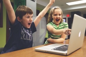 enthusiastic-children-playing-on-computer